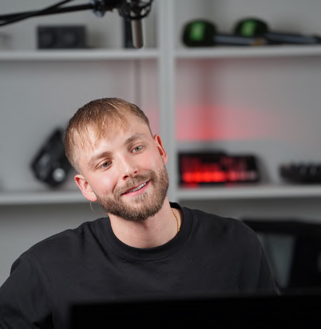 A webinar host presenting to camera